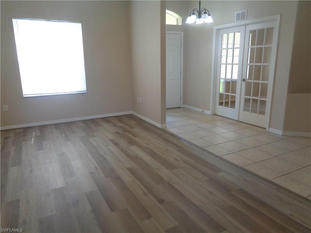 View of the Living Room and Den, featuring wood-style flooring and tile