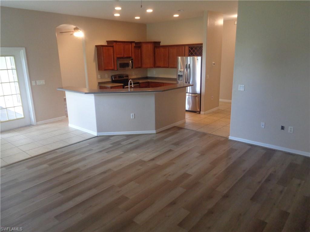 View of the Family Room and Kitchen featuring wood-style flooring and tile flooring