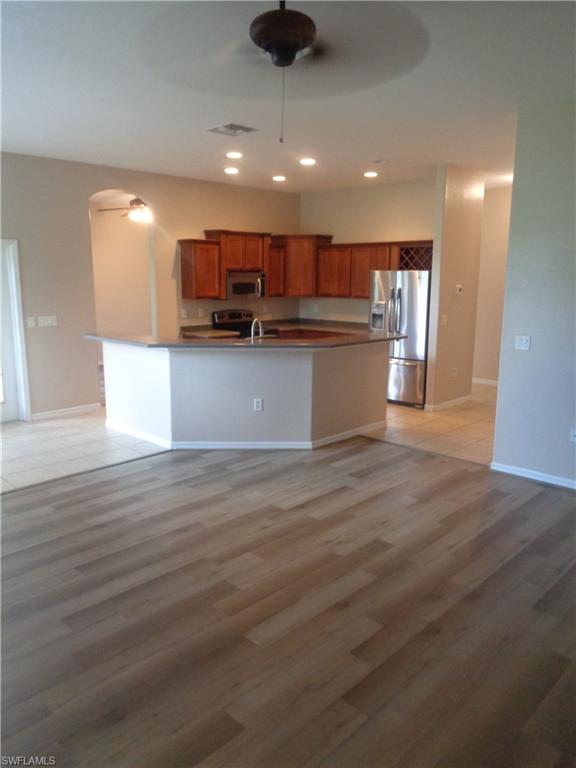 View of the Family Room and Kitchen featuring wood-style flooring and tile flooring