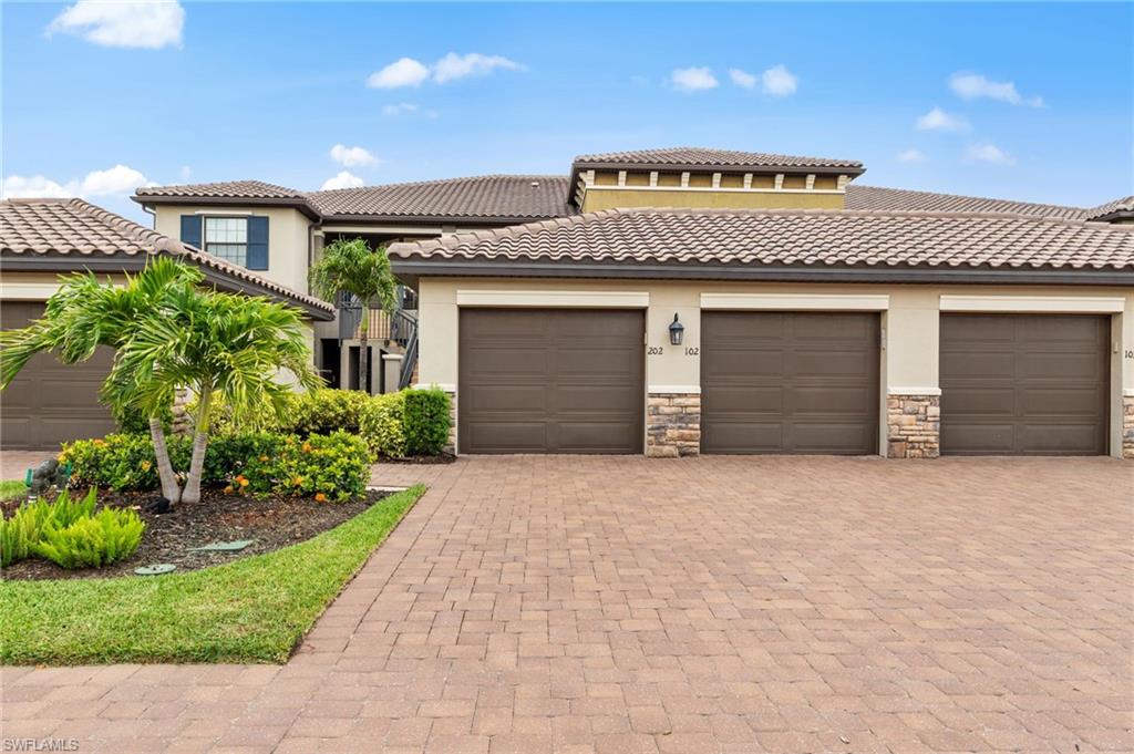 Multi-unit property with a Mediterranean-inspired tile roof and stucco exterior