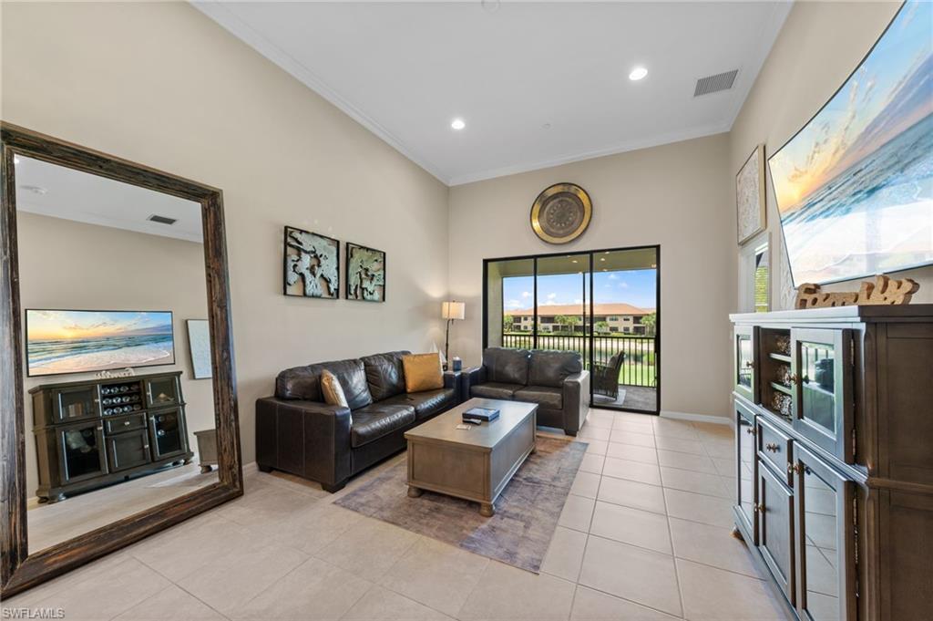 Living area with high vaulted ceilings and tile flooring