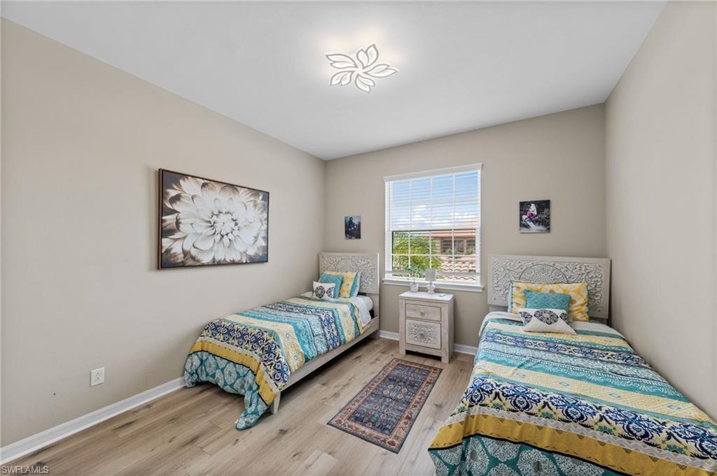 Room with light wood-finish flooring and neutral wall tones