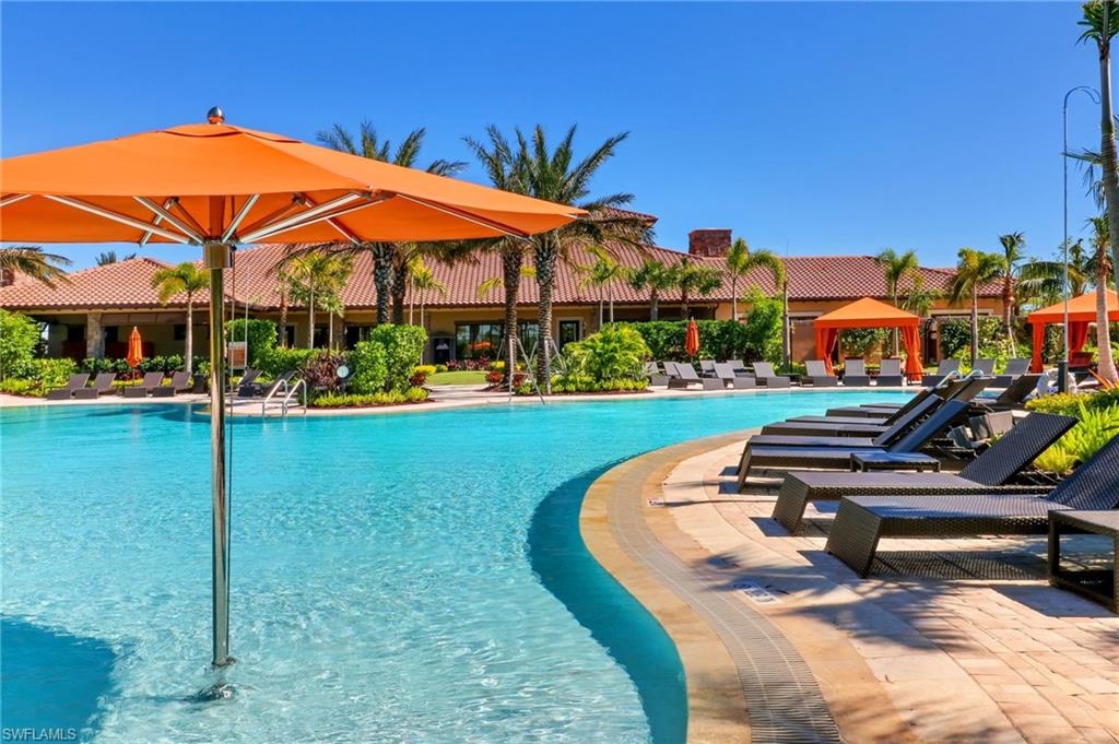 Resort-style pool with a curved edge and integrated in-pool umbrella