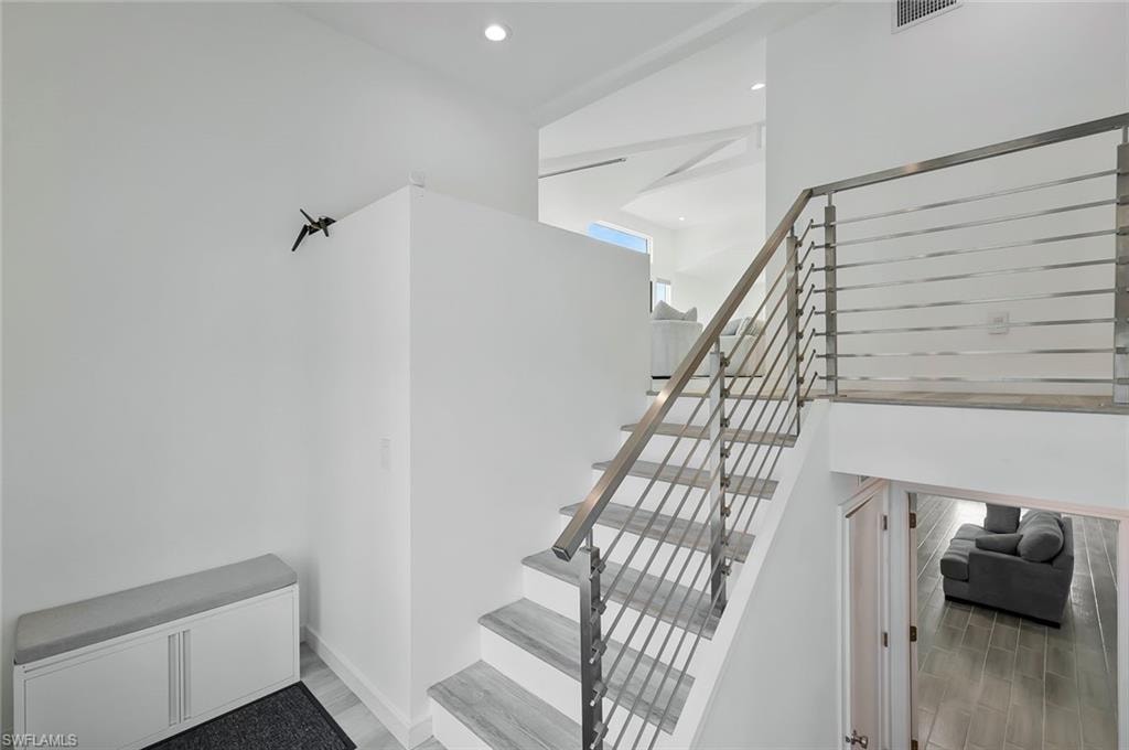 Upon entry, upper level living area up a few stairs and lower level living area and bedrooms down a few stairs