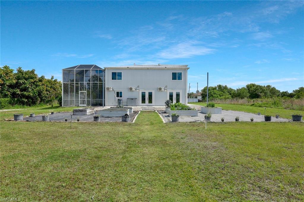 Rear of home with vegetable growing area