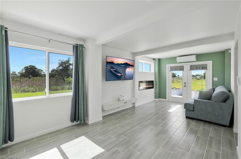 primary bedroom lower level with doors opening to the rear garden