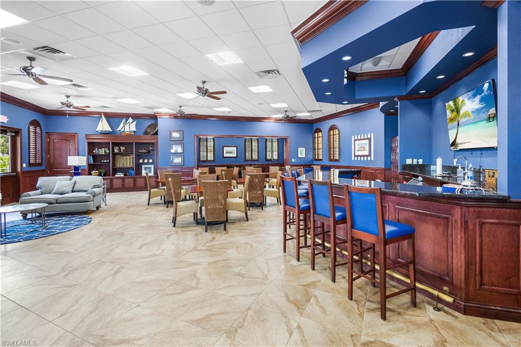 Gulf Harbour Yacht Club is a separate entity from the country club. This facility is reserved exclusively for yacht club members and their guests.The interior features striking deep-blue walls complemented by rich, wood-inlaid tables, creating a refined coastal ambiance. Private liquor lockers are available for lease, and the bar area is designated for member use only. Please note that no bar service is provided.