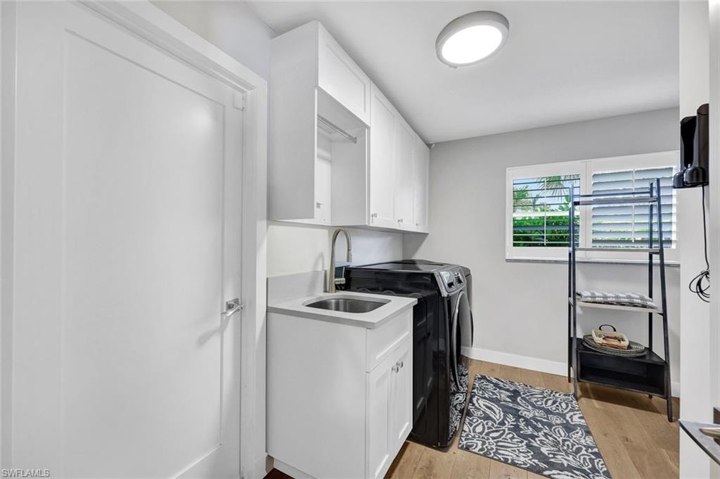 Laundry Room with owners closet sink and cabinets