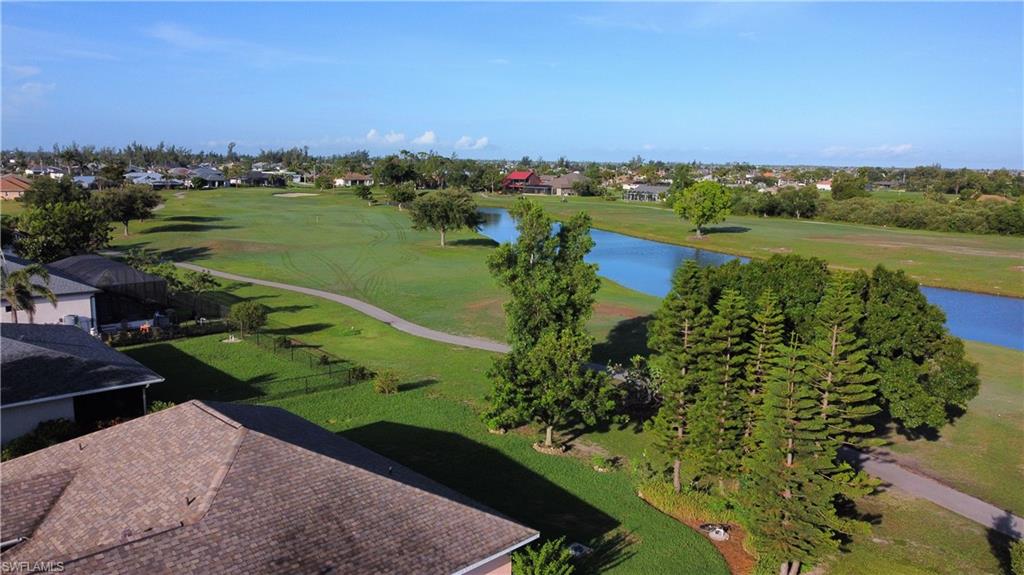 Aerial perspective highlighting a golf course setting with a prominent waterway