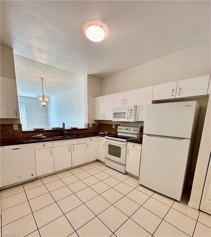 Tiled kitchen with Solid Surface Countering/Backslash