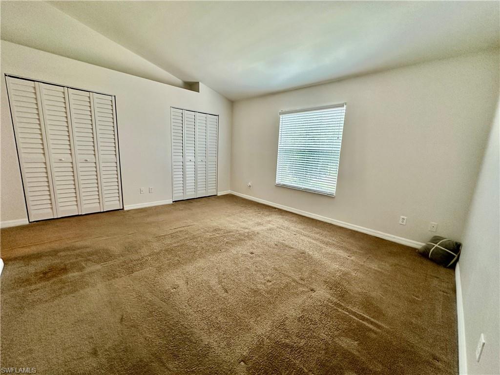 View of Primary Full Wall Closetry and Front Window