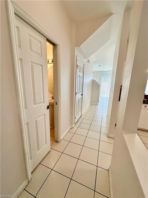 Interior Entryway with half bath left and kitchen right