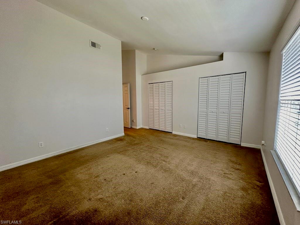 Another view of Primary with Full Wall Closetry and Entrydoor