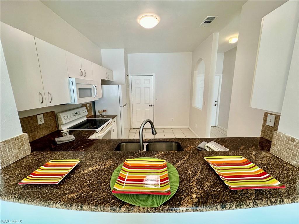 View of Kitchen from its Breakfast Bar