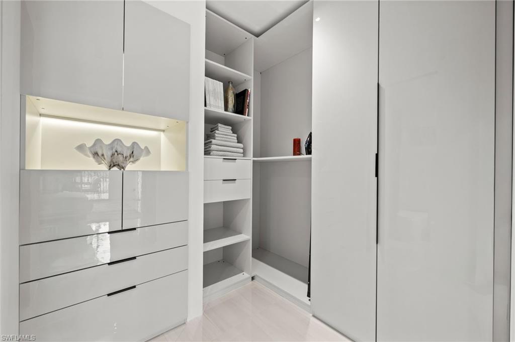Integrated closet system featuring a high-gloss white finish