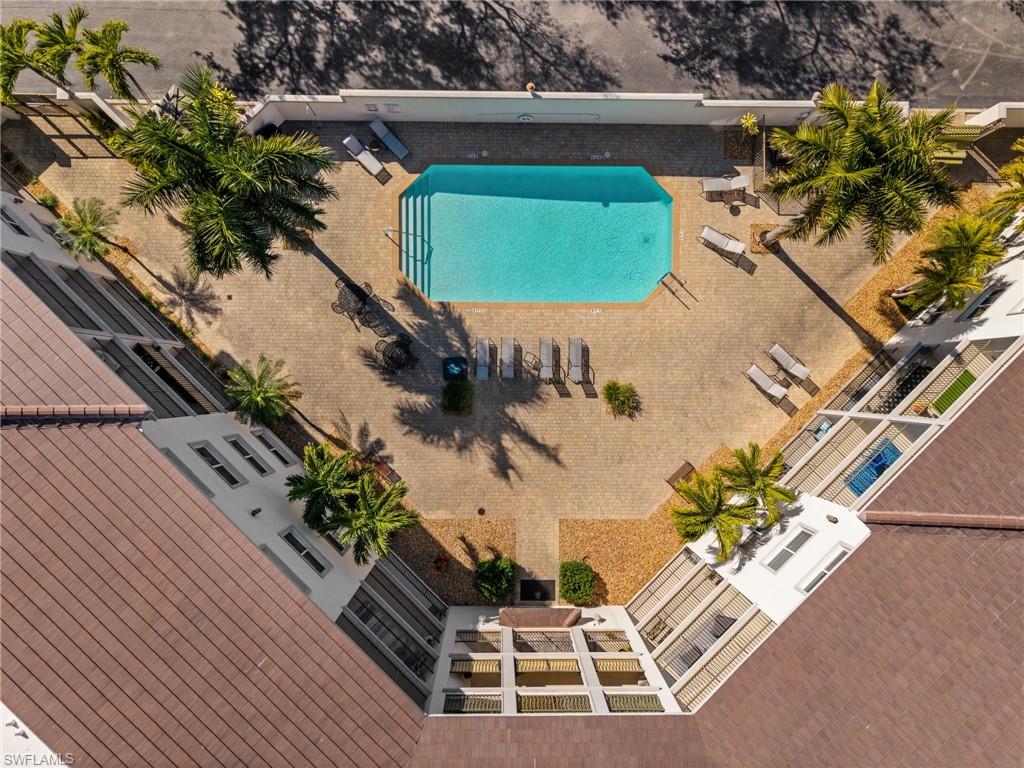 Rectangular swimming pool surrounded by a paver patio