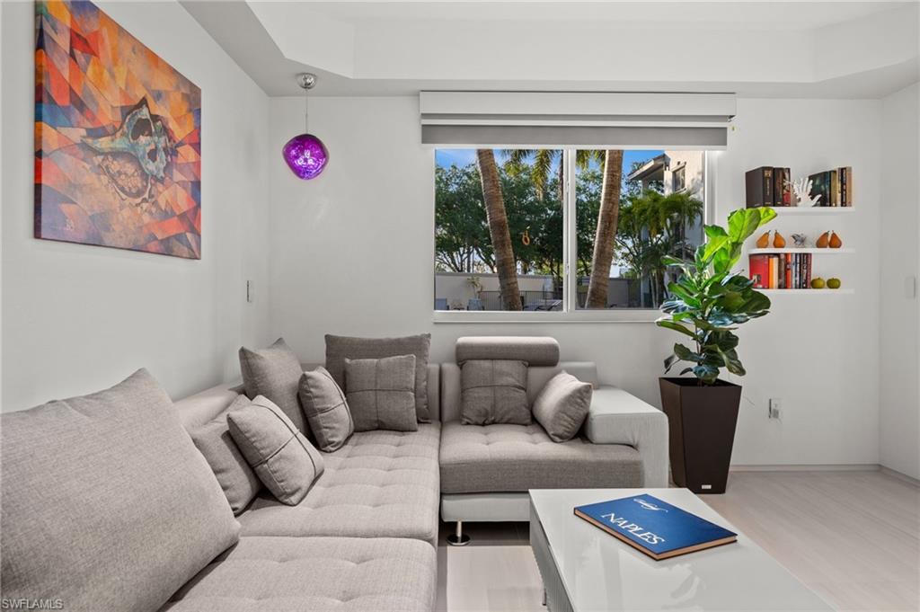 Bright interior space featuring light-toned walls and wood-finish flooring