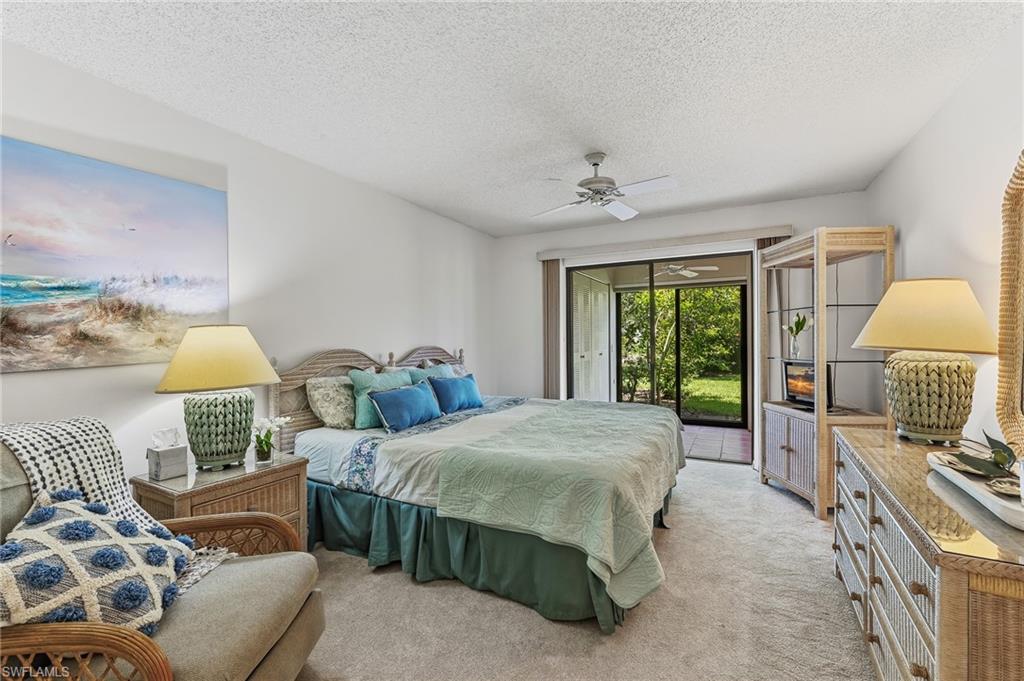 Spacious primary bedroom with lanai views