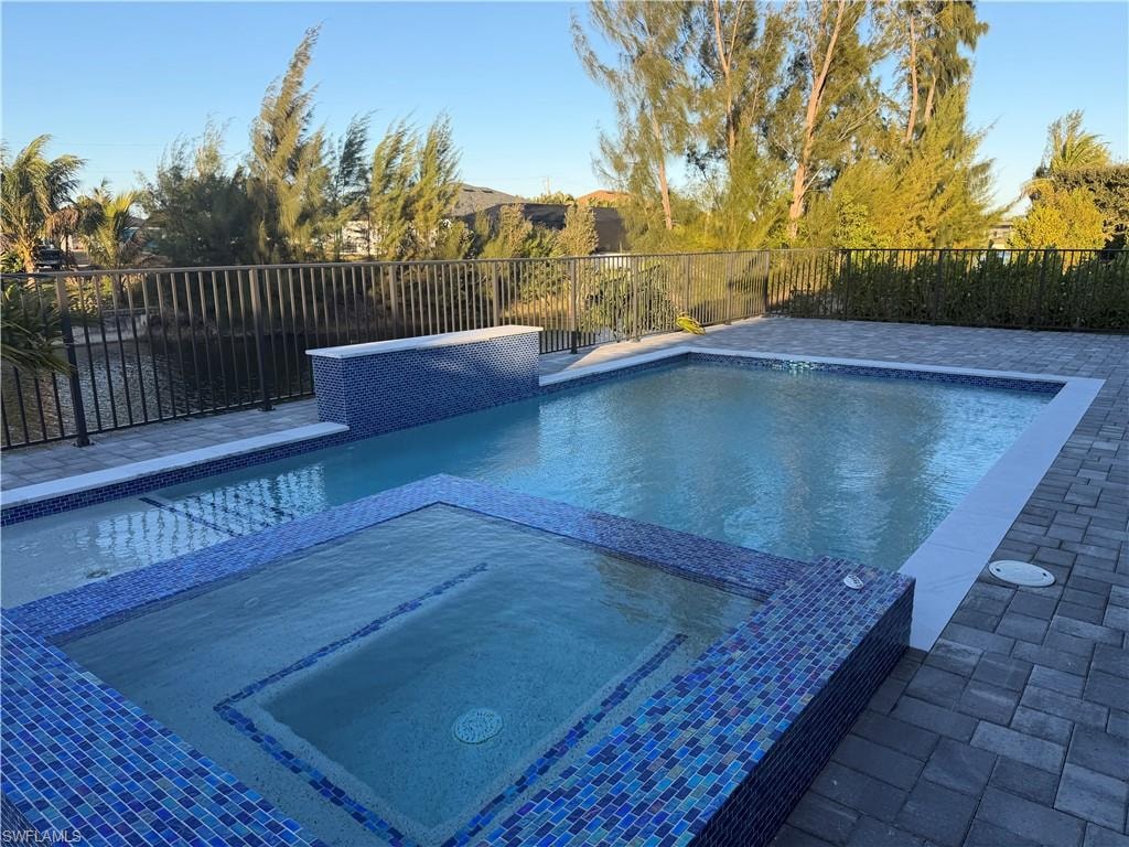 pool with spa, waterfall, electric heater