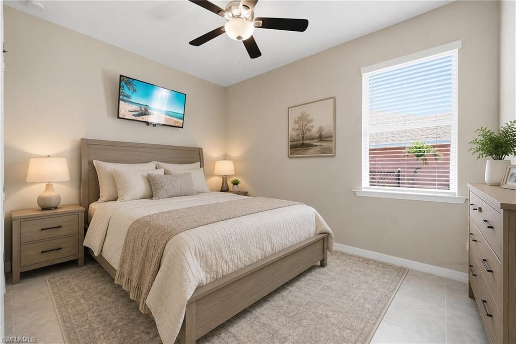 Bedroom featuring light-toned wall paint and tile flooring