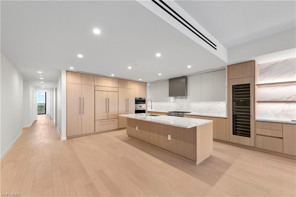 Italkraft Cabinetry, Polished Porcelain, ,Task Lighting, West Bar, 10' Island, 102 Bottle Dual Zone SubZero Wine Fridge