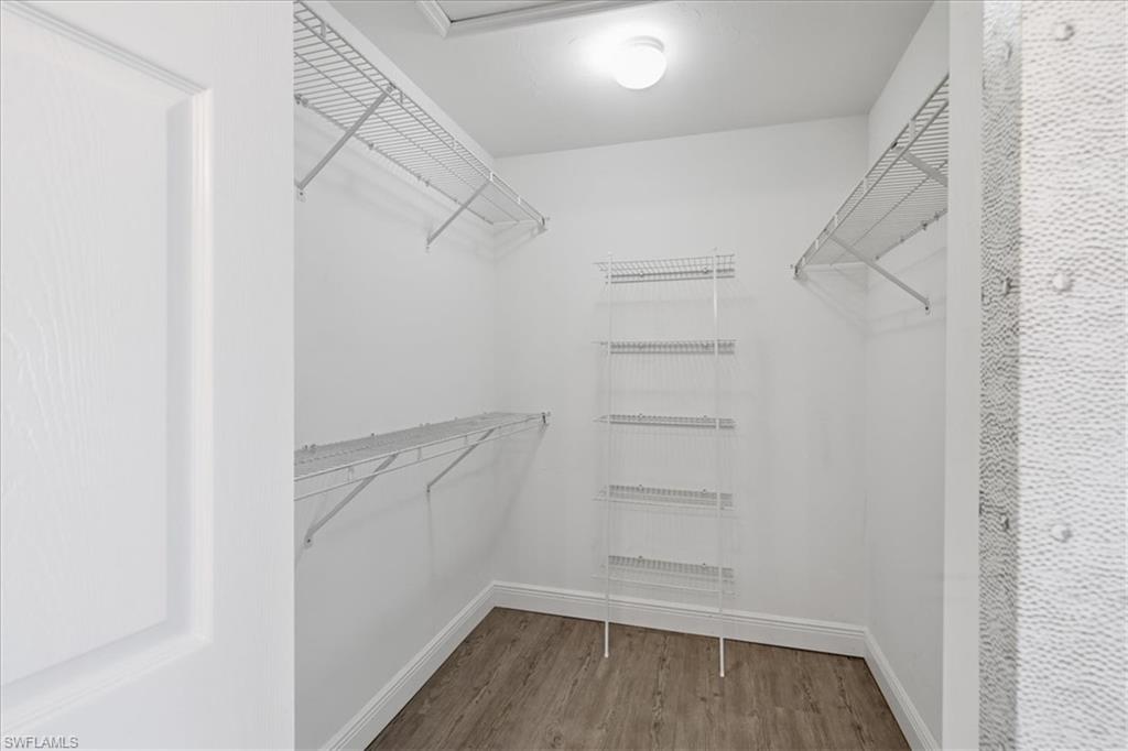 large walk-in closet in primary bedroom