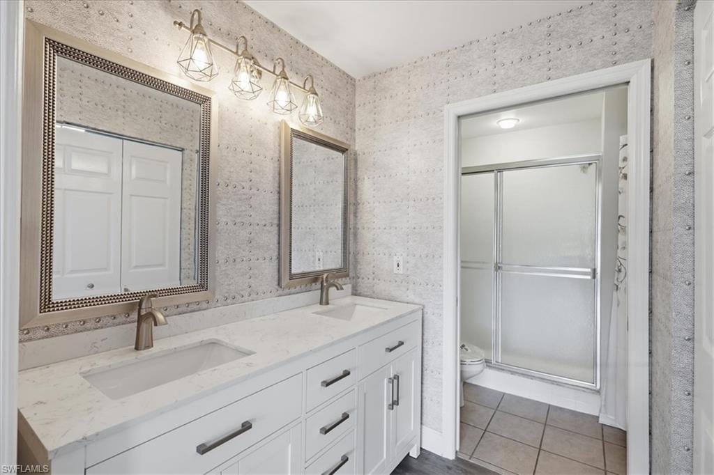 new quartz dual vanity, mirrors, custom designer wall coverings, self-close dovetailed drawers