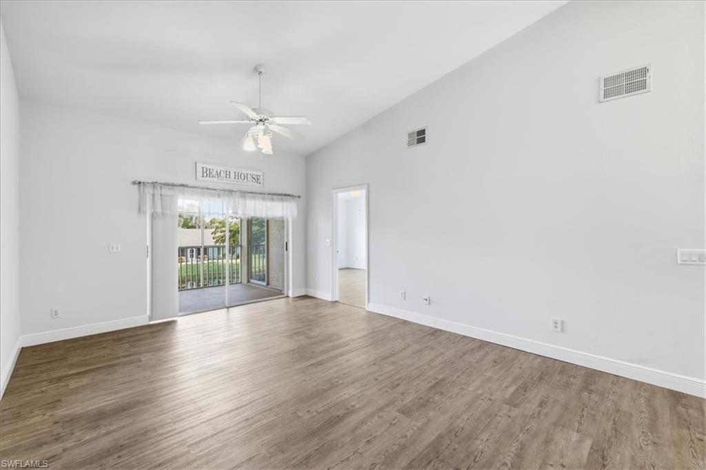 vaulted ceiling, lake view, new luxury vinyl plank flooring