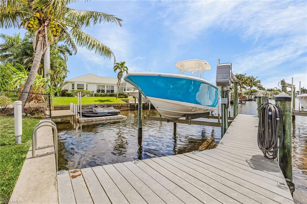 Newer seawall with Composit Dock and 7500 pound lift with LED lights along the dock, water and electric.