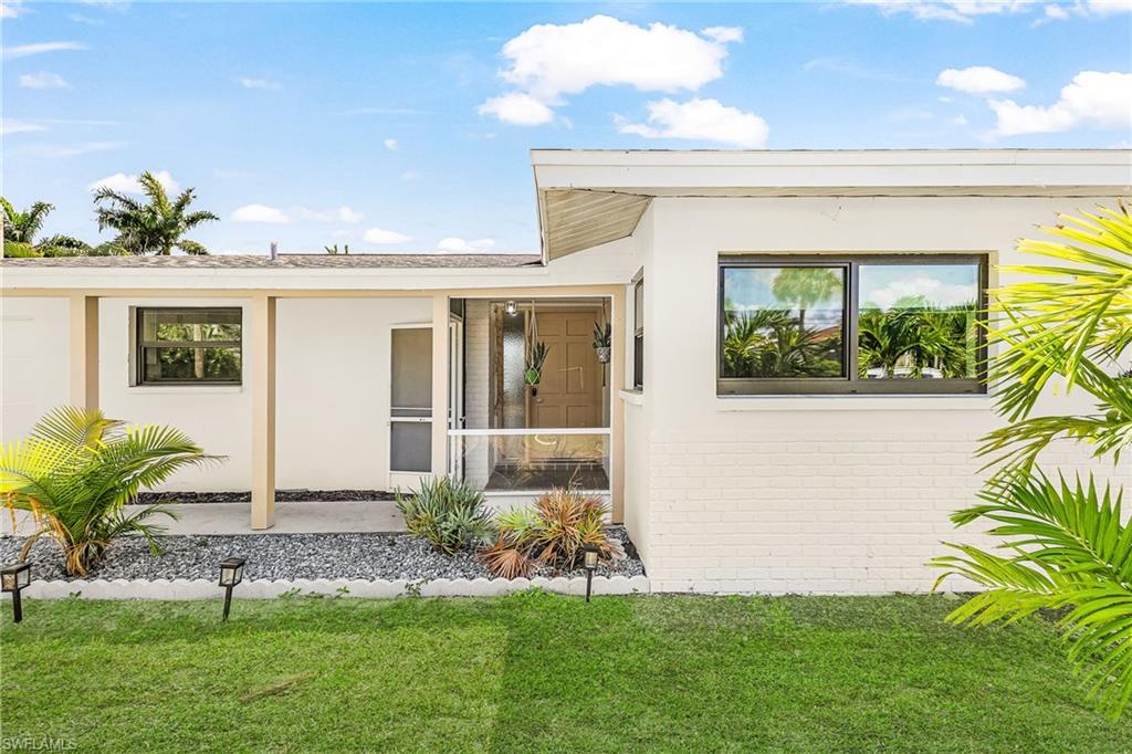 Screened front entry to enjoy the River breezes and Riverfront Neighborhood