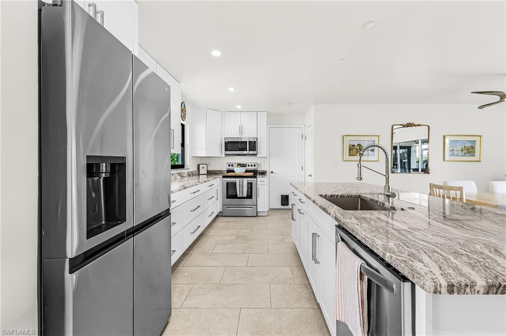 Great new kitchen with door to garage and open to living/dining area