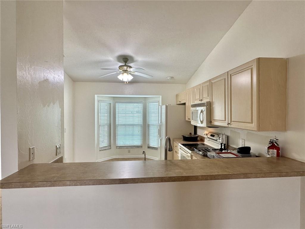 2306 view of breakfast bar into kitchen