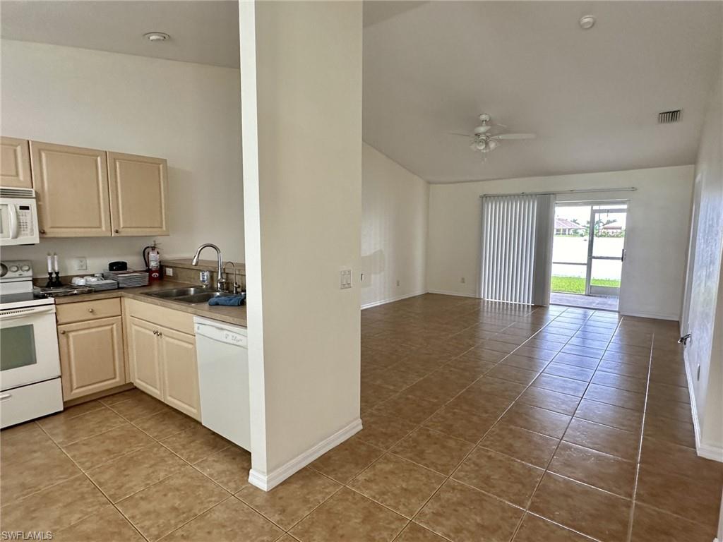 2306 entry viewing tiled kitchen and greatroom