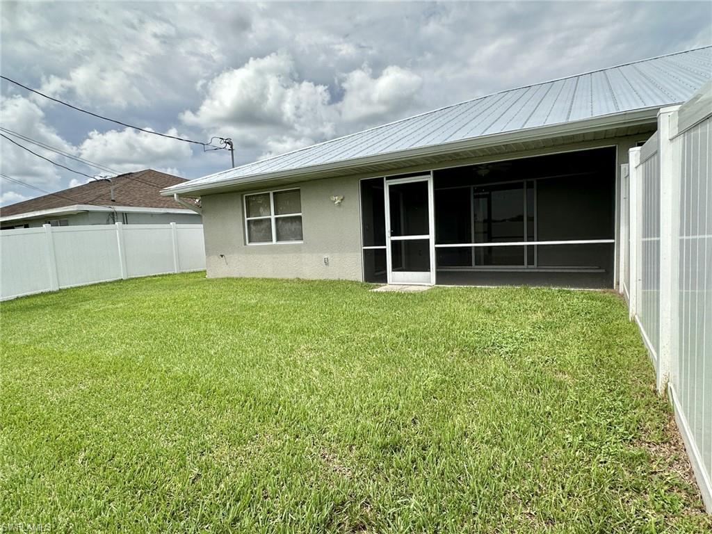 2306 yard with screened lanai under truss and divider fence