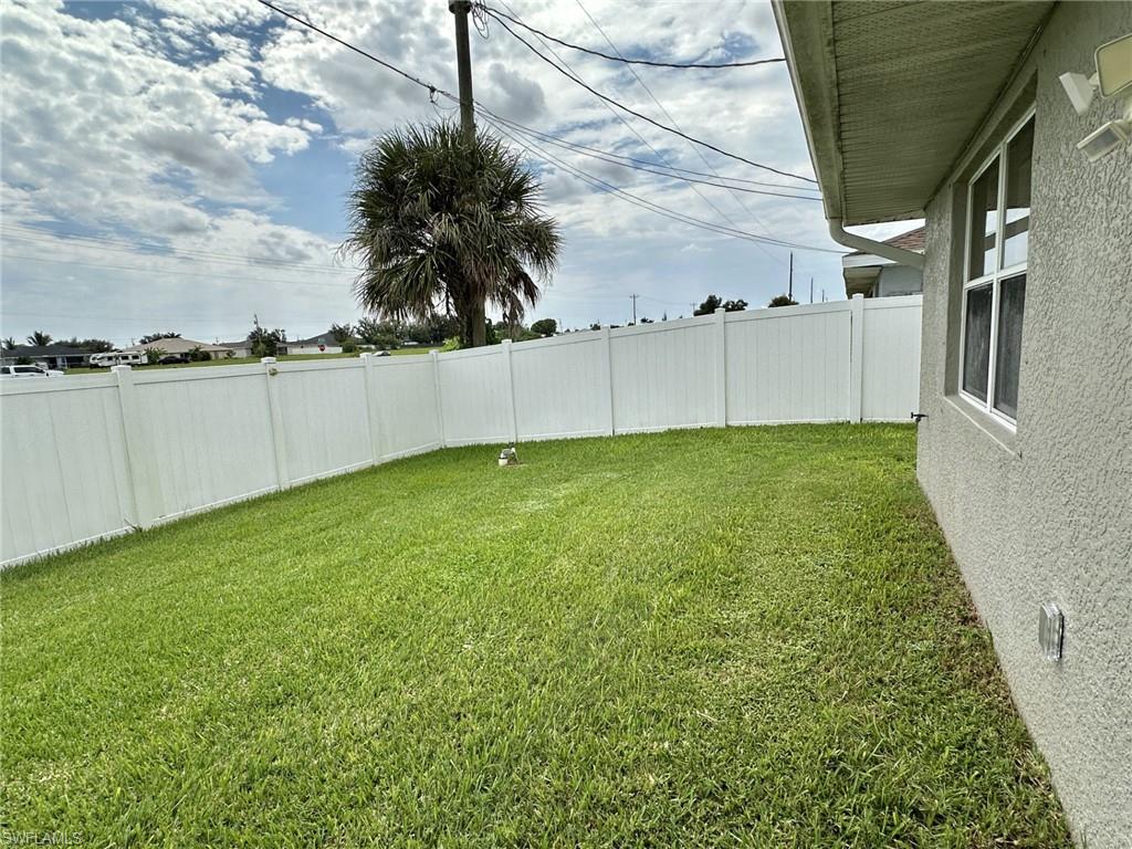 2306 view of white vinyl fenced yard