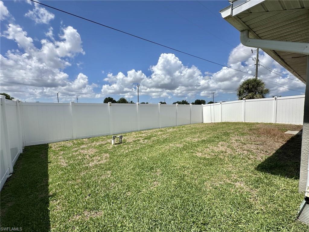 2306 view of yard and white vinyl fencing