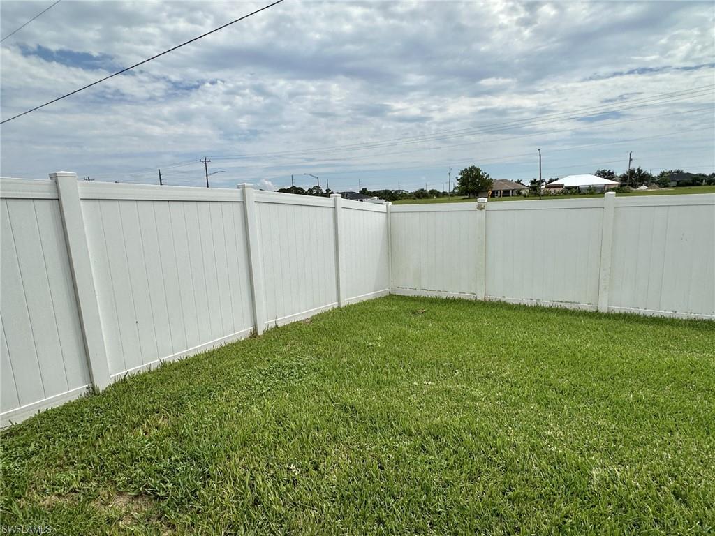 2306 view of white vinyl fenced yard and divider