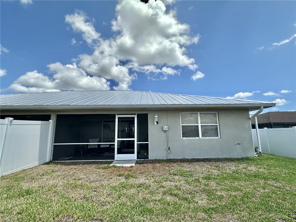 2308 yard with screened lanai under truss and primary ensuite double windows