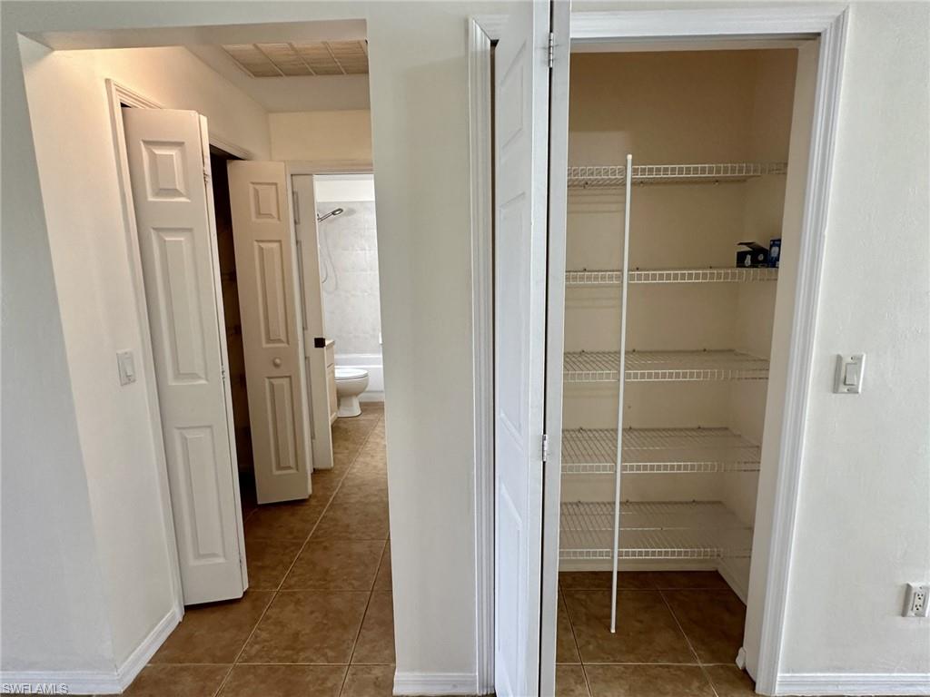 2306 view of pantry, hallway storage to second bath and bedroom