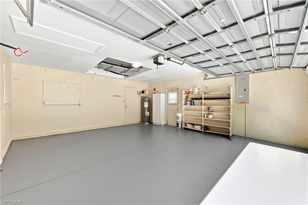 Spacious two-car garage with light gray epoxy flooring