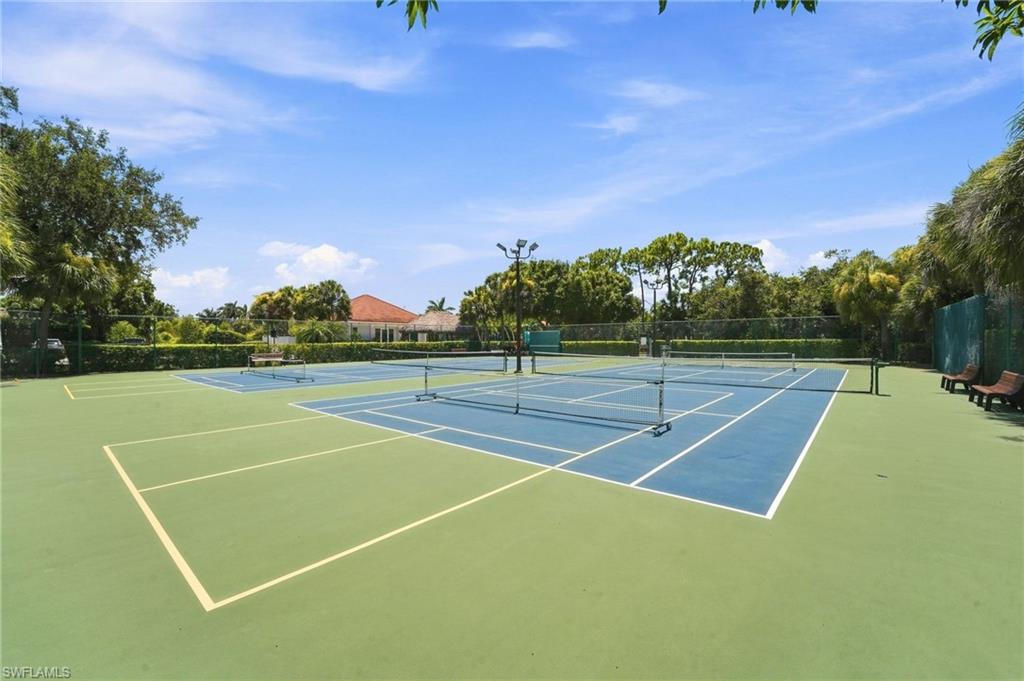Multiple tennis courts with blue and green surfacing