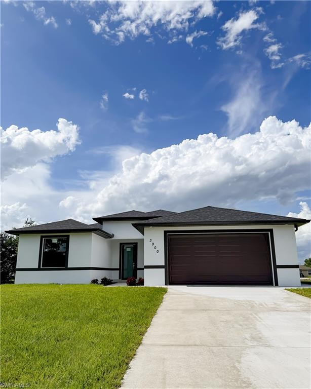 Contemporary white stucco exterior with dark trim and a dark shingle roof