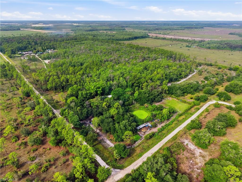 Expansive natural landscape featuring a mix of dense forestation and open land