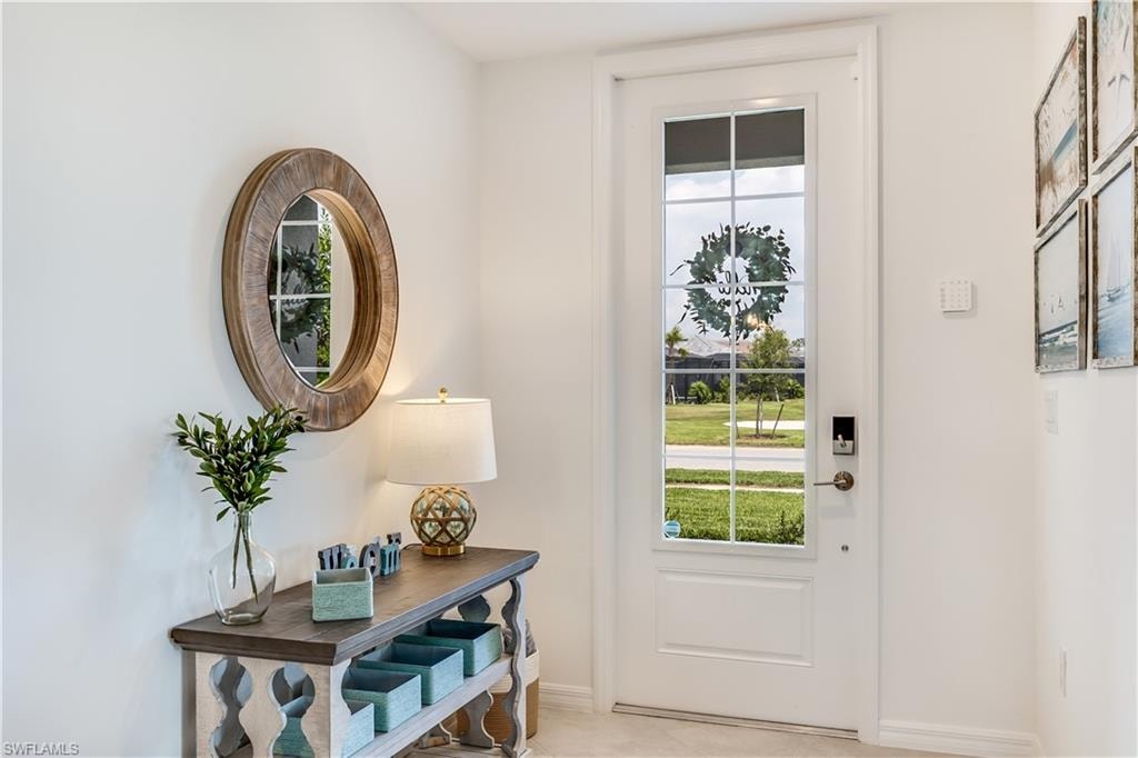 Entryway featuring light tile floors