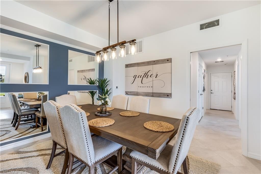 Dining area with light tile floors