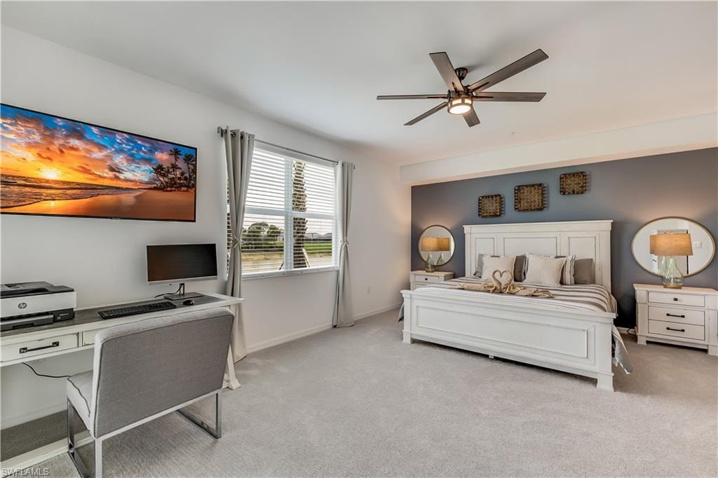 Carpeted bedroom with ceiling fan