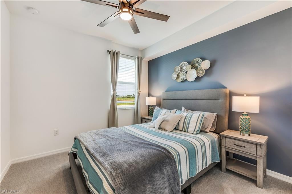 Bedroom featuring carpet and ceiling fan