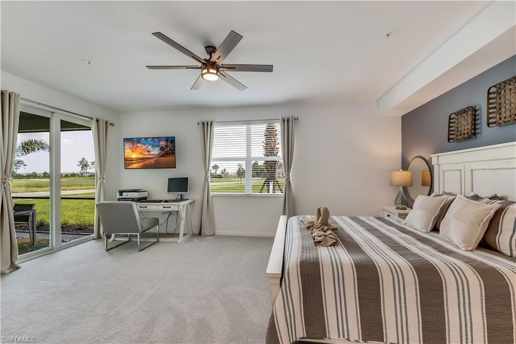 Bedroom featuring carpet, ceiling fan, and access to outside