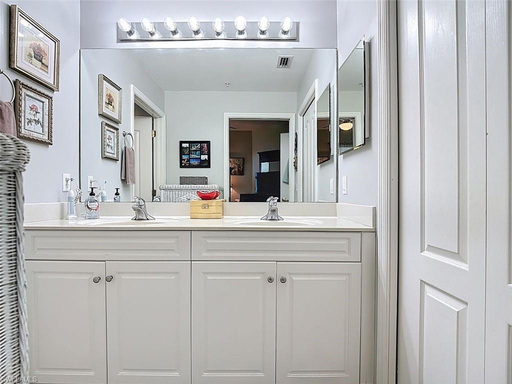 Full bath featuring double vanity