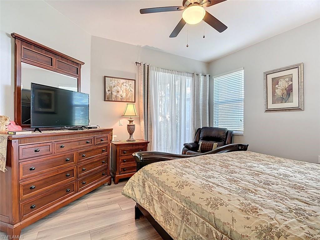 Bedroom featuring a ceiling fan and light wood-type flooring